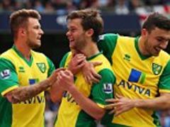 Manchester City 2 Norwich 3 - Premier League match report: Jonny Howson's winner gives Norwich a surprise victory at the Etihad Stadium